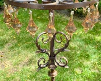 Lot 2200 $65.00. Antiqued, bronze color stand with 5 candle holders, 16 plastic crystals. 51" H x 15" Diameter. This would be charming holding some plants as well.