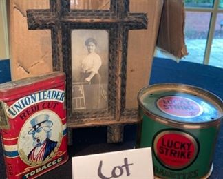 Lot 2172. $25.00. 2 antique or vintage tobacco tins & one old photo. Union Leader Redi-cut Tobacco; Lucky Strike cigarettes in tin & frame and an antique cabinet photo of a woman.
