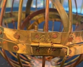 Lot 2173. $275.00. Rare. An Antique Gimbal Whaler Lamp of brass and copper. Appears to be handmade, early 19th Century. Has a "32" stamped on the hinges. The lamp has a gimbal in it which allows the lantern wick to never turn over. Blacksmiths used to make the iron black gimbal whaler lamps, while the ships' men would make the copper and/or brass ones. This appears to be crafted and never used. Look at the type font of the #32 - very old.