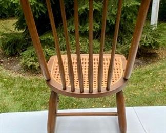 Lot 2206 $125.00 Vintage cane rocker with spindle back. 17" W x 30" D x 35" H