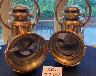 Lot 2249. $80.00. 2 Brass Railroad Signal Lights. At first we thought these might be auto headlights for an early Model T, but they do have a red light on one side, and then a headlamp on the main side and, and the glass cover swings open to reach the burner inside. The glass cover is broken on the right lamp, which shouldn't be hard to replace - and everything else appears to be in pretty good shape.