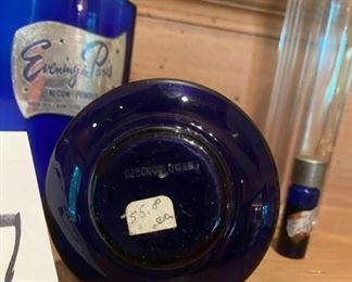 Lot 2237, $50.00 Vintage "Evening in Paris" Talcum Powder in a bottle; a small vial of "Evening in Paris" perfume; Beautiful Cobalt perfume bottle with gold floral etching; 7" tall clear Tulum bottle.