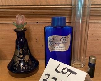 Lot 2237, $50.00 Vintage "Evening in Paris" Talcum Powder in a bottle; a small vial of "Evening in Paris" perfume; Beautiful Cobalt perfume bottle with gold floral etching; 7" tall clear Tulum bottle.