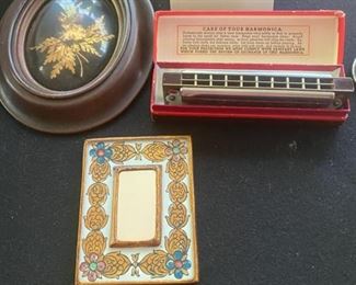 Lot 2250 $30.00 Old hand mirror made in Peru by Rojo. Real Hawaiian flowers petrified in gold, by Saburo Inc Oncidium Orchid, Palaa Farm gold plated in 24k gold. Please note that the harmonica shown was apparently put in this lot by mistake and in another that previously sold