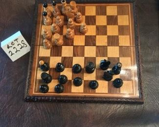 Lot 2228. $30.00. Wooden Chess Set (folds down the middle, beautiful carved edges with hinge. Not all pieces included (14 tan and 15 black). We added an additional set of pieces, felt bottomed, plastic)