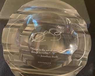 Lot 2269, $28.00. Levenger crystal ashtray in presentation gift box. 6" diameter. Says, "Vision is the art of seeing things invisible", by Jonathan Swift