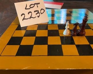 Lot 2230. $22.00. A sweet travel chess set with a full set of wooden pieces. Velvet lined board is painted, brownish and black, not in perfect condition but it plays great!
