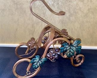Lot 2275, $25.00. Reed and Barton Wine bottle coaster, 7.5" D, and a vintage wine bottle caddy in a darling grapevine pattern