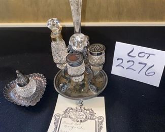 Lot 2276. $250 for both. 1) Sterling and crystal Cruet Set made in England,. circa 1875. pd $300 in 1989 from the Little Traveler in Geneva and 2) Delicate Birmingham sterling inkwell on heart-shaped base, c. 1894. Purchased at the Prairie House for $217