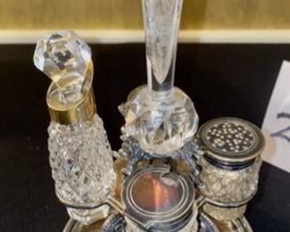 Lot 2276. $250 for both. 1) Sterling and crystal Cruet Set made in England. circa 1875. pd $300 in 1989 from the Little Traveler in Geneva and 2) Delicate Birmingham sterling inkwell on heart-shaped base, c. 1894. Purchased at the Prairie House for $217