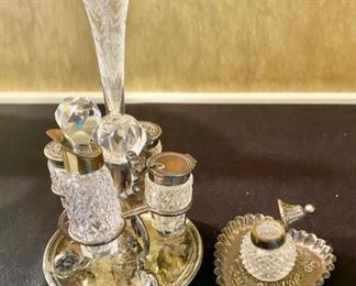 Lot 2276. $250 for both. 1) Sterling and crystal Cruet Set made in England,. circa 1875. pd $300 in 1989 from the Little Traveler in Geneva and 2) Delicate Birmingham sterling inkwell on heart-shaped base, c. 1894. Purchased at the Prairie House for $217