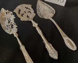 Lot 2278, $30.00. 3 beautiful cake servers, all very ornate. Serve your next pie or cake with some pizazz!