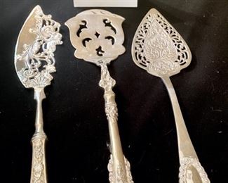 Lot 2278, $30.00. 3 beautiful cake servers, all very ornate. Serve your next pie or cake with some pizazz!