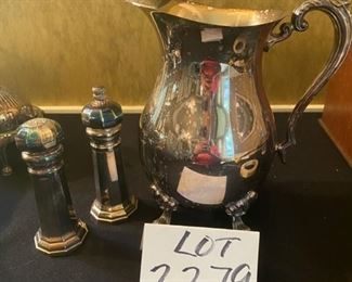 Lot 2279. $55.00. 1) Rogers Silver Co. Water Pitcher and Sheffield salt shaker and pepper grinder, signed "The Sheffield Silver Co.".