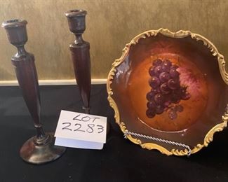 Lot 2283, $18.00. Pair of wooden candlesticks 12" tall, some wax residue. A Rembrandt Bavarian Plate, 11" diam, Scalloped edge with attached plate holder on the back of the plate. Easel not included..