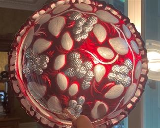 Lot 2284, $95.00. Antique Cranberry, scalloped edge serving bowl. Super heavy, lead crystal cut-to-clear cranberry bowl. Frosted and clear glass raspberry and pattern. It is oh, so stunning as you can see from the picture! The owner paid $300 at an antique store for this bowl.