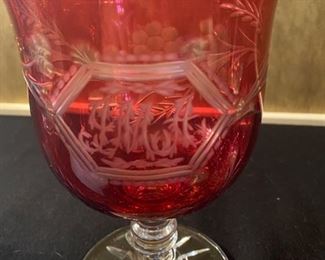 Lot 2288. $85.00 1) Cut to clear cranberry pedestal dish etched, 9" x 6" . 2) Cranberry Perfume Bottle with stopper hand painted, featuring a boy on a bicycle. 7" x 3.5". (Paid $110.00 for just the Perfume Bottle)