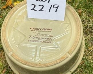 Lot #2219. Asking $225 for all 4 pieces plus the lid. 3 gal butter churn crock. The churn paddle shown doesn't fit this crock, but not sure what it does fit, so we've put it in with this lot. Also included is a nice looking 3 gal Red Wing Pottery crock, and a Country Cooker" Made for an Amana range, by Western Stoneware. Small Chip on side handle.