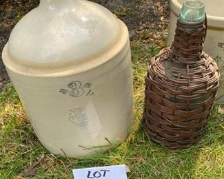Lot #2220. $250.00. 3 gallon, Super Nice Monmouth IL. Pottery Crock- No cracks. 3 gal. SP+S Illinois Pottery (Whitehall, IL) jug. Exterior chips at the bottom- no cracks. 1 gal glass wine jug in wicker