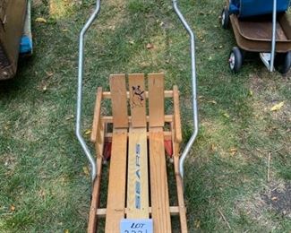 Lot #2221. $47.50. Vintage Sears Wooden Toddler Sled w/folding handle + runners. Also comes with seat cover to keep your tot warm on the sledding hills.