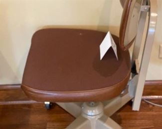 Lot 2246. $50.00. Cool Vintage Industrial Style Task or Office Chair. Our guess is it is from the 1950s. The chair adjusts in Height on a screw. They don't make 'em like this anymore!