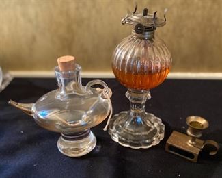 Lot 2291. $38.00 1) Leichlingen Germany Oil Lamp 6.5" x 5". 2) Lantern w/o globe 9" x 4". 3) Candle and match holder, brass, 3.5" x 2.5"