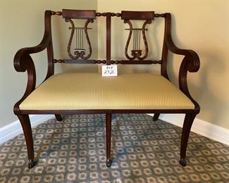 Lot 2326 $1,200.00. Vintage 1930-1940's Hand-Crafted Italian Mahogany Lyre-Back Settee with Scrolled Arms on hand-carved feet. The seat is upholstered in a neutral striped soft yellow and gold fabric. Burled Wood Top with Brass or Copper Plate above the Lyre. Has Matching arm and side chair for nice grouping. See next lots. 39.5"W x 34" H x 18"DS. Site online has this "on-sale" from $4,000 to $2,625.