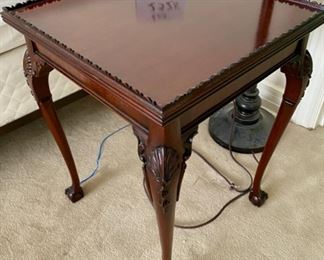 Lot 2328. $125.00 Beautifully Detailed Mahogany Occasional Table with carved legs, with ball & claw feet, unique fringed rim. 17" sq x 22" high