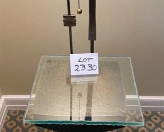 Lot 2330 $825.00 This Lamp is Very Special. Hand-Crafted Antique finished Brass Lamp/Table. Artist-made, solid wand switch pull. Stunning Artistry! The homeowner paid a fortune for this lamp, and we can see why! Includes a glass top, but we think this piece looks best without it. 62"T x 18.5"W x 18" D