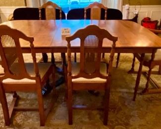 Lot 2266 $595.00. Beautiful Antique Dining Table with six Dining Chairs with Upholstered Seat Cushions (these were reupholstered by our homeowner). Dining Table has FOUR, COUNT THEM FOUR 12" Leaves and Custom Pads for the entire Table. This table will sit an army, perfect for upcoming Holidays! The Base is original and the 4 extra Legs were added for stability when the Leaves were being used (the FOUR support legs can be removed) the entire set has been restained and lightened to match the Buffet and Hutch in Lot 2293. Lot 2267 is a matching buffet in the original color. Table: 66" L x 46" W x 29" H. Each Leaf is 12" W x 46" L. There is also a small china cabinet in later lots that matches this set! At half price, of $297.50, this is truly a steal and in magnificent shape. You will hit yourself on the head if you don't buy this now!.