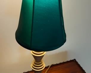 Lot 2332. $45.00. Mid-century brass bedside table lamp. Cool atomic ball feet. Needs a new shade, the green one (included) has a hole and needs to be replaced. Good Bones!