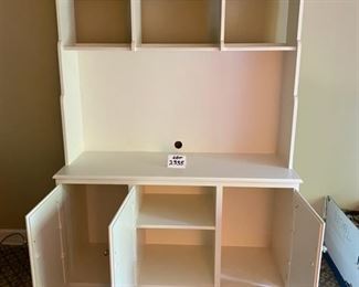 Lot 2335. $195.00. One-piece media center w/shelves and 3 doors for great storage. This item is heavy and will need lots of muscle for you to move it... We will NOT be moving this for you:). This could double as a kitchen hutch, storing dishware, table cloths or place mats, larger display pieces on the shelves. Or holding a tv in the bedroom or guest room, or even an office. Soft white/cream finish; this was made with care, 52"w x 19"d x 79" t