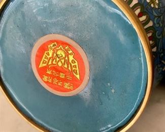 Lot 2339. $225 for the pair. Pair of Antique Chinese Cloisonne vases, PR of C Stamp of release on bottom of Vase. 10" x4.5" on round wooden footed base.