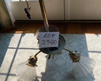 Lot 2340. $150. Antique Triple lamp chandelier. Brass with frosted ruffled glass shades. Interesting brass work at center. From Cavalier Lighting. Inventory from 1830-1930. 22" x 20" dia