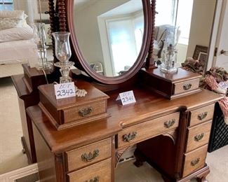 Lot 2341 $250.00 Nice Old Antique Vanity w/ 2 Bible Boxes" 6 side drawers and one center drawer and oval mirror with barley twist supports. Has cute little feet! 48" W x 19.5" D x 65" H. Matching Bench Not Pictured here. This would be darling as it is now, or painted, for a little girl's or teen's room, a guest room or removing the mirror piece and using as a desk. At half price, it's a steal.