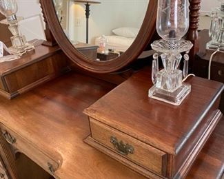 Lot 2341 $250.00 Nice Old Antique Vanity w/ 2 Bible Boxes" 6 side drawers and one center drawer and oval mirror with barley twist supports. Has cute little feet! 48" W x 19.5" D x 65" H. Matching Bench Not Pictured here. This would be darling as it is now, or painted, for a little girl's or teen's room, a guest room or removing the mirror piece and using as a desk. At half price, it's a steal.