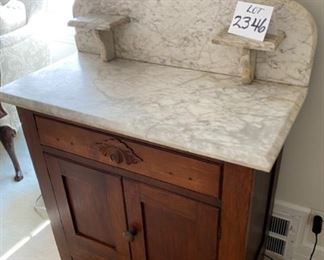 Lot 2346 $225.00 Fabulous Marble Topped Antique Cabinet. Antique Oak handle and two shelves. Marble has signs of wear and a crack, but sharp looking never the less. 30" W x 16" D x 39" H