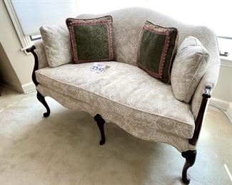 Lot 2347 $600.00. Upholstered Antique Settee w/Queen Anne Legs and Camelback design. This settee is in like-new condition! It was reupholstered and was beautifully redone in a current fabulous fabric. Seat depth 20" Seat H 19.5" Overall: 54"W x 34"H. Great piece for a Living Room or Bedroom Suite, or really any place that could use a stylish piece like this - plus it's sooo comfortable. Change the throw pillows to any color that matches your decor. You will not find a better loveseat or settee anywhere for this price!