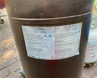 Lot 2314 $125.00 AZ Patio Propane gas heater. 41,000 BTU includes 1 FULL propane tank. The top Cover of the Heater is slightly bent, as shown in photo. We think it looks like a guy tipping his cowboy hat, and we like it!