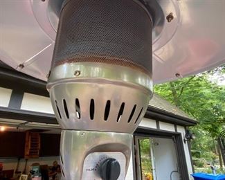Lot 2314 $125.00 AZ Patio Propane gas heater. 41,000 BTU includes 1 FULL propane tank. The top Cover of the Heater is slightly bent, as shown in photo. We think it looks like a guy tipping his cowboy hat, and we like it!