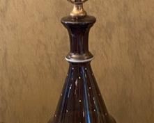 Lot 2391 $48.00. Vintage Amber/Brown Glass lamp w/ Hand-painted leaf vine motif and dots. Tested. The lamp is a little crooked at the base. Not sure if this can be fixed. With the right shade, you wouldn't notice it! Metal base 33" to top of harp, 19" to top of the glass.