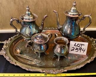 Lot 2394 $140.00. Wallace Coffee/Tea Set. Includes: Waverly by Wallace Coffee Pot, Tea Pot, Creamer, Sugar and a waiter's tray in the Baroque pattern by Wallace. Also includes a music note scooper from Neiman Marcus (Hopelessly Devoted to Brew). The sugar bowl is missing its finial on top, but it is included inside. "Waiters Tray: 29"L x 18"W. Pots: 12"H & 11"H