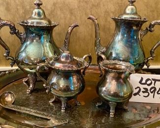 Lot 2394 $140.00. Wallace Coffee/Tea Set. Includes: Waverly by Wallace Coffee Pot, Tea Pot, Creamer, Sugar and a waiter's tray in the Baroque pattern by Wallace. Also includes a music note scooper from Neiman Marcus (Hopelessly Devoted to Brew). The sugar bowl is missing its finial on top, but it is included inside. "Waiters Tray: 29"L x 18"W. Pots: 12"H & 11"HPots: 12"H and 11"H