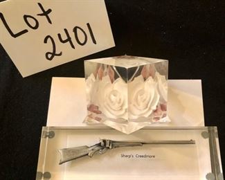 Lot 2401. 9 souvenir spoons, 1 pewter scooper, 1 small W. Germany scooper, Mt. St. Helens Ash, Sharps Creedmore in lucite and flower in lucite. Plus 2 antique sterling place card holders.