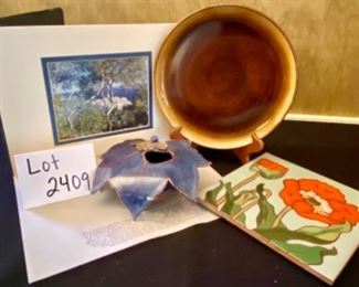 Lot 2409. $50.00. Russel Albright by Oneida Cookie Plate (9.25" dia), Studio Pottery signed leaf vase with frog, Handpainted Flower Trivet (8" sq.), Matted Monet print ready to frame (9"x12" with matting)!. (plate stand not included).