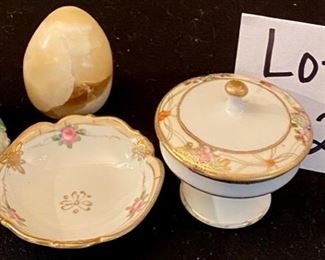 Lot 2410. $65.00 8 pc Lot featuring: Fox Door Knocker (brass), Antique mini nude (painted on the ceramic), Nippon china footed trinket dish and small bowl, cool marble egg, and ceramic baby shoe, Brass Owl Pin, and Brass Lute Pill Hinged Box.