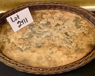 Lot 2411. $55.00. Vintage Wicker Tray with embroidery under glass (Some damage on one handle, 20"x13"), Mustard Napkins w/holder, 8 vintage place card holders (vintage flowers w/glass inserts), 12 napkin rings (signed mexican ceramics), 3 pewter or bronze napkin rings.
