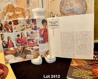 Lot 2412. $40.00. Makemyday cookbook holder, 2 antique Ladies Home Journal Vintage Prints (Kraft Cheese and Canning), 3 cookbooks (cheese and canning, obviously)