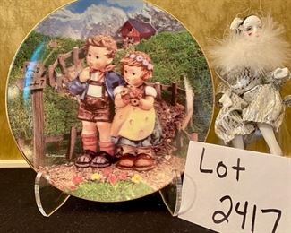 Lot 2417. $40.00. Hummel Collector Plate, 5 bisque Village People 😂 (One is a mini-toby mug), 2 small dolls made in Soviet Union, one porcelain face doll ornament.