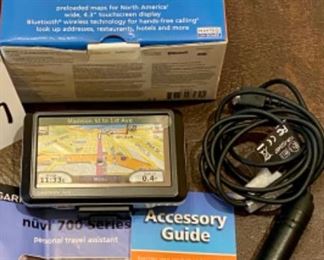 Lot 2427 $36.00 Nav Package includes: Garmin nuvi 760 (missing window Bracket and New Garmin Handheld eMap (electronic map) in open box.